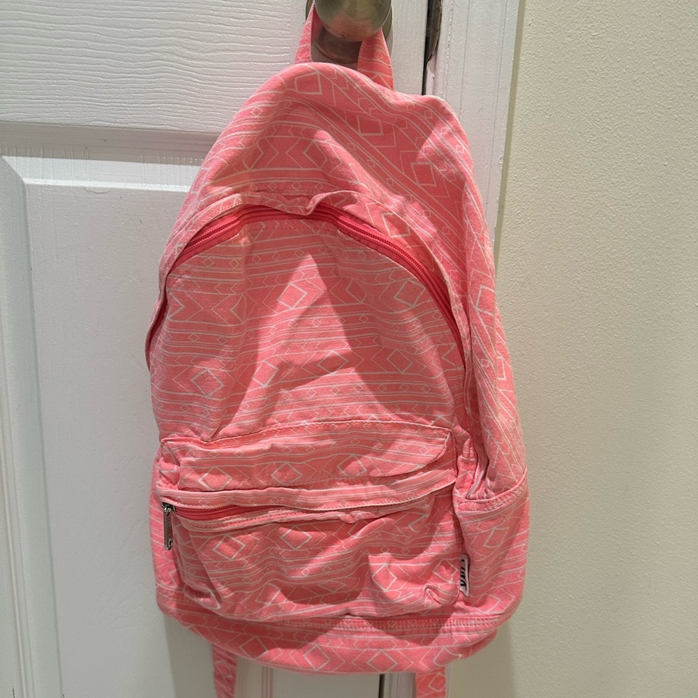 Victoria secrets PINK backpack. Pink and white with a design.